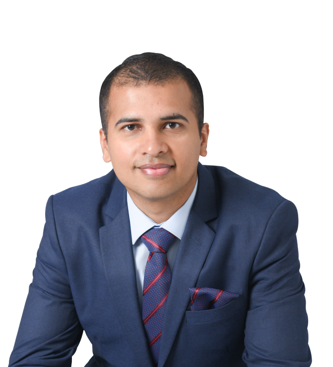 Ryan Rajan is wearing a business attire with a blue suit and white polo in the inner